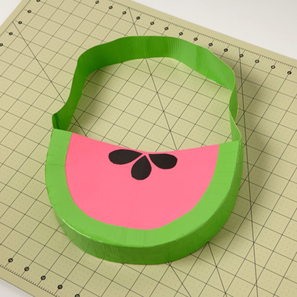 Finished Duck Tape fruit themed bag with the seeds from previous step attached