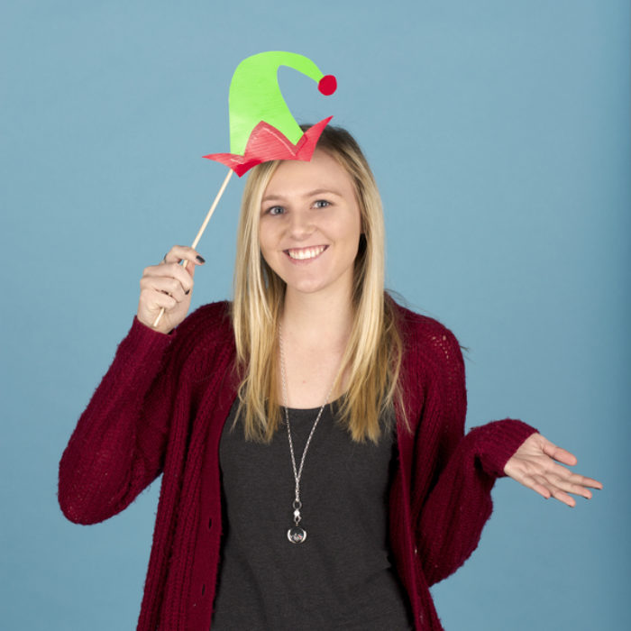 Woman posing with photo booth props made from Duck Tape